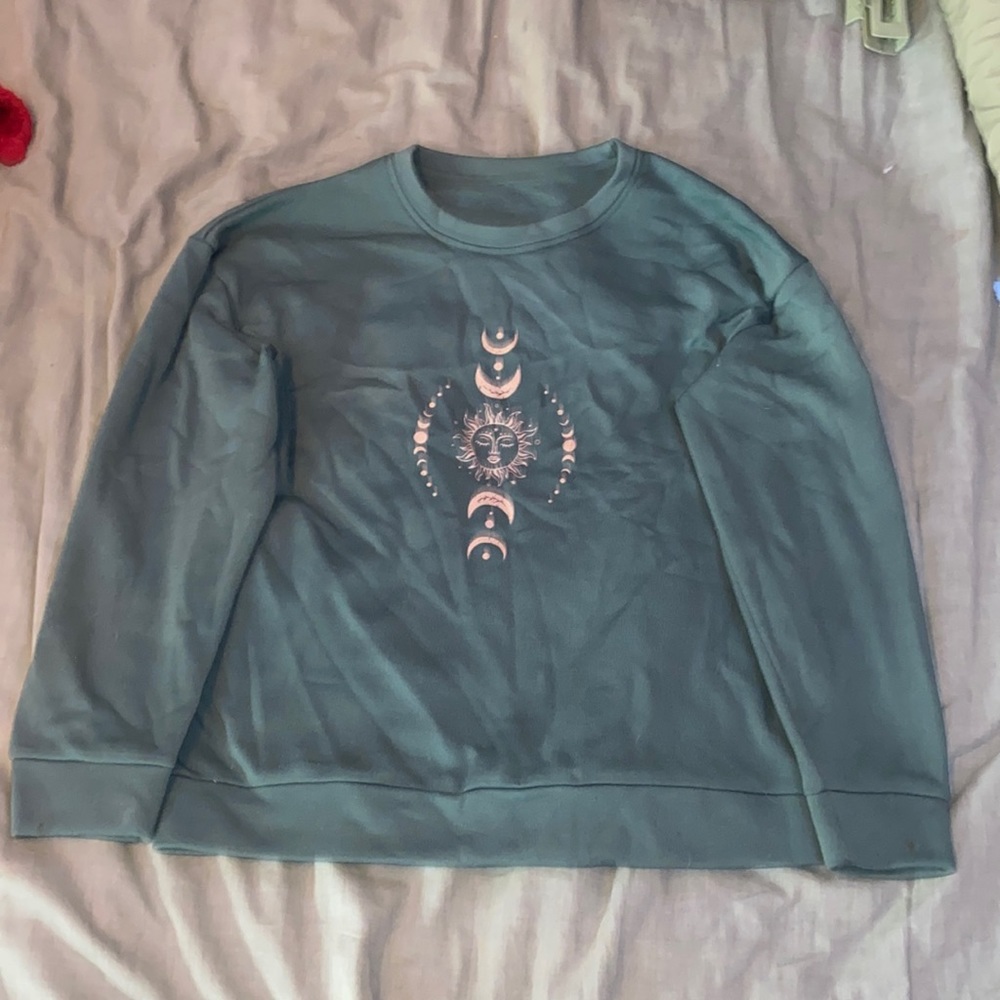 Green sweatshirt.
